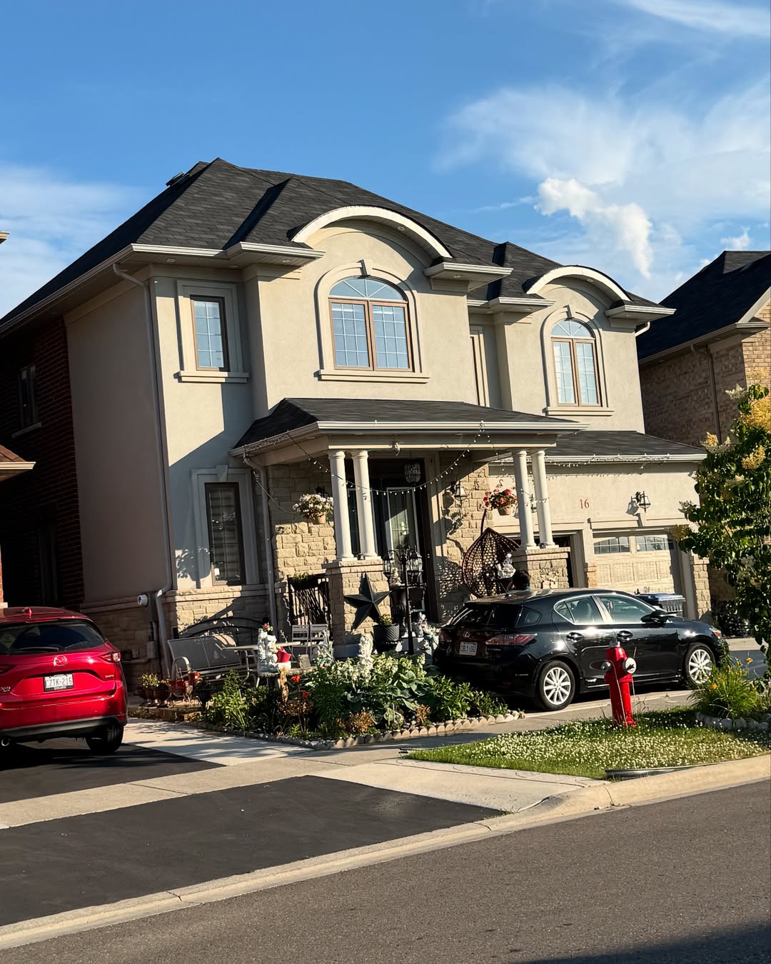 Luxury home with stucco and stone veneer exterior