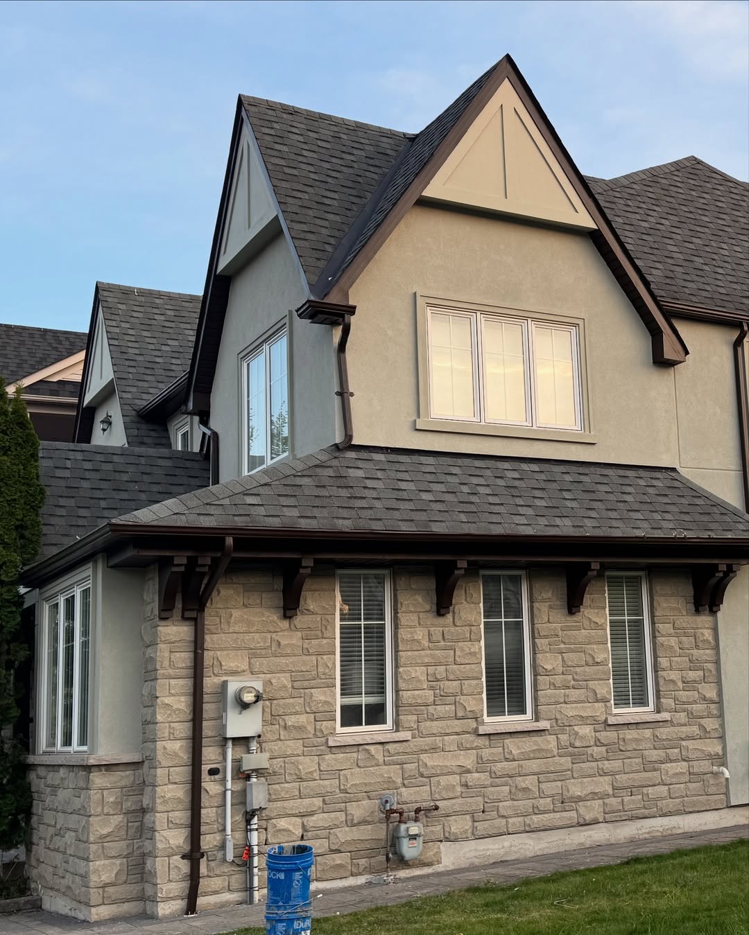 Two-story home with siding and stone veneer accents