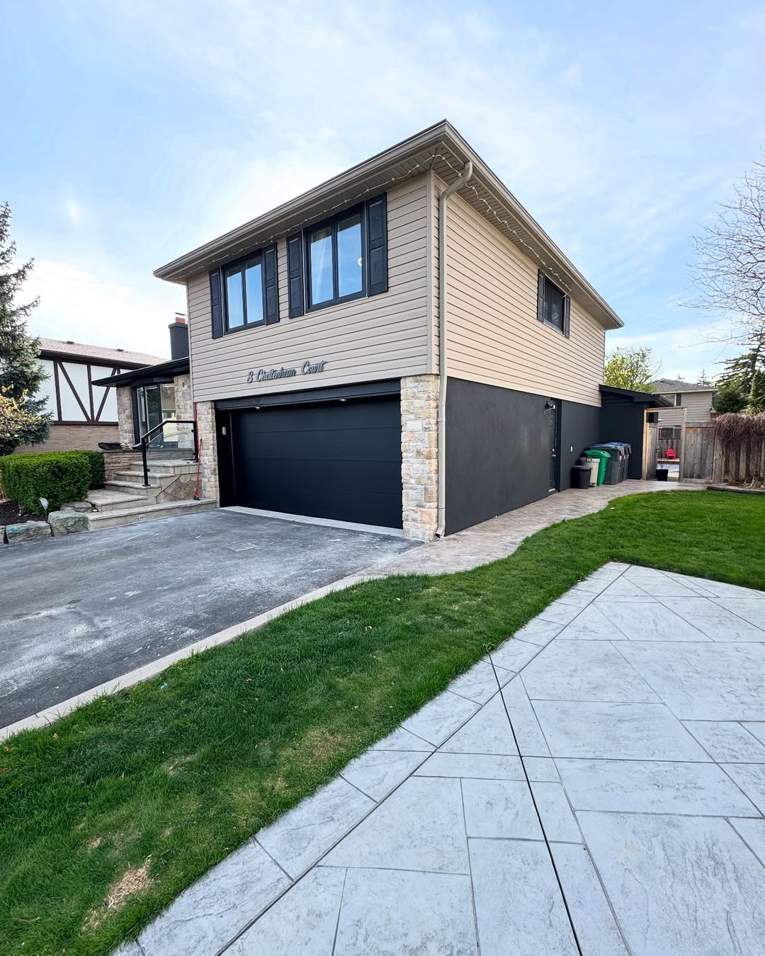 Modern home exterior with siding and large garage